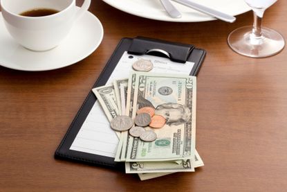 Money left on a table as a tip at the restaurant.