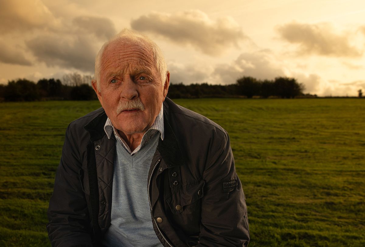 Eric Pollard looking worried with Yorkshire scenery behind him.