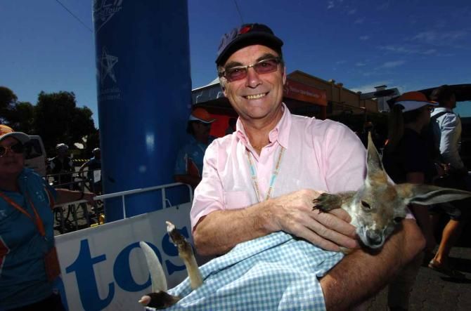 Bernard Hinault makes a friend on stage 3 of the Tour Down Under.