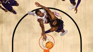 Bennedict Mathurin #0 of the Arizona Wildcats dunks the ball against Eddie Lampkin #4 of the TCU Horned Frogs during the second half in the second round game of the 2022 NCAA Men's Basketball Tournament at Viejas Arena at San Diego State University on March 20, 2022 in San Diego, California.