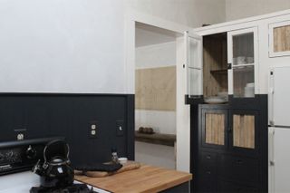 A two tone white country kitchen with black border
