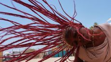 A woman attends a dance workshop at the Biennale of Dance in Africa, held at Ecole Des Sables in Toubab Dialaw, Senegal