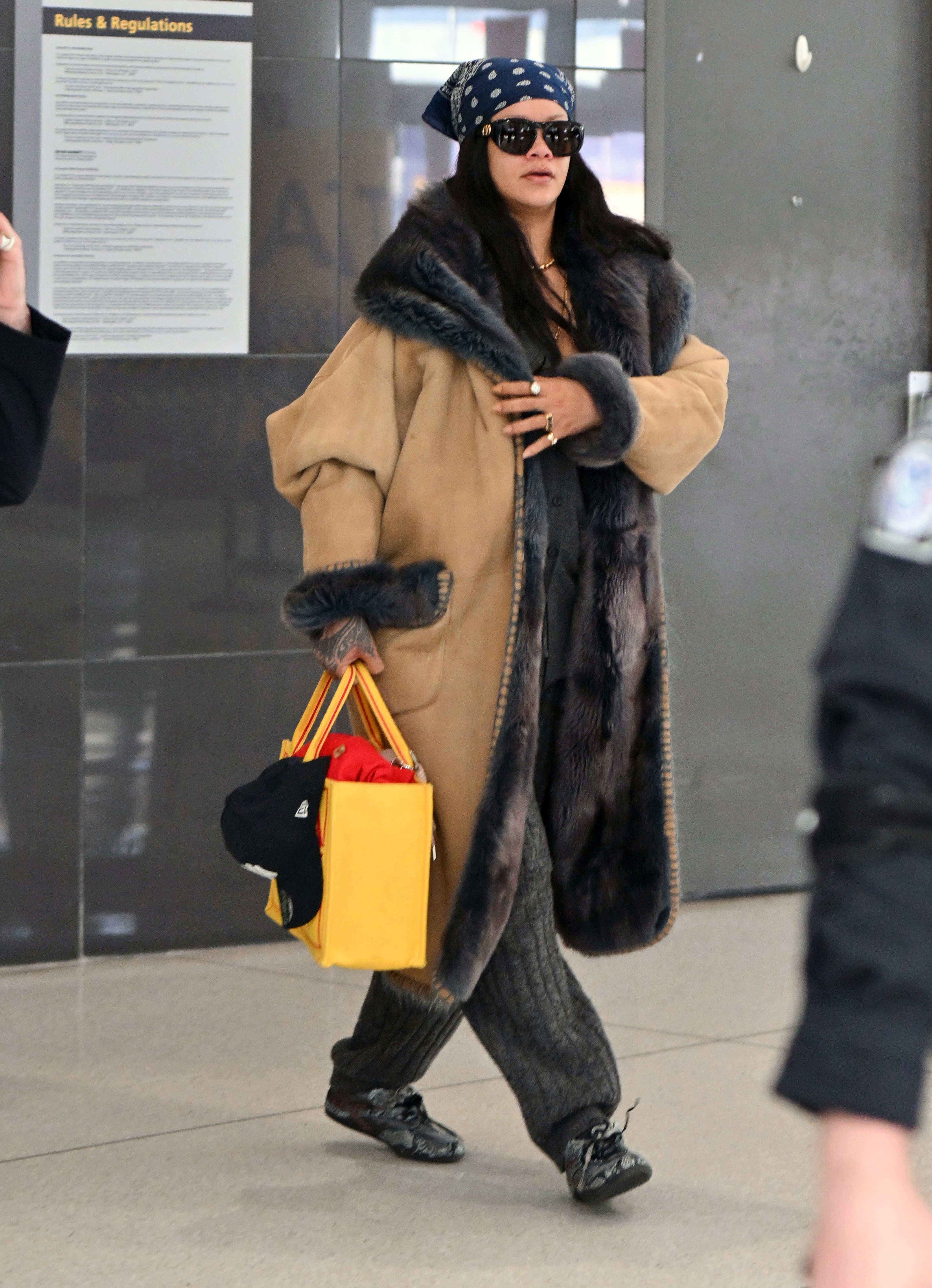 Rihanna was spotted at the airport in Jennifer Lawrence's favorite airport book tote bag from Dior