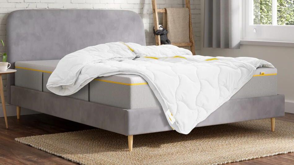 The Eve sleep multi-way duvet on a grey bed in a well-lit bedroom