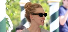 Amanda Seyfried wearing black cats eye sunglasses