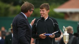 Matthew Fitzpatrick of England is presented with the silver medal for the leading amateur player during the final round of the 142nd Open Championship at Muirfield on July 21, 2013