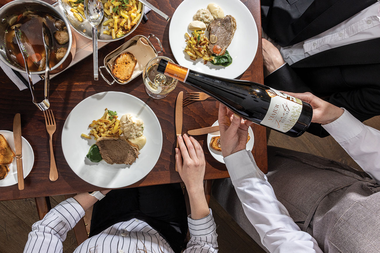 Riesling poured with plates at Arte restaurant, P&amp;aacute;lffy manor house