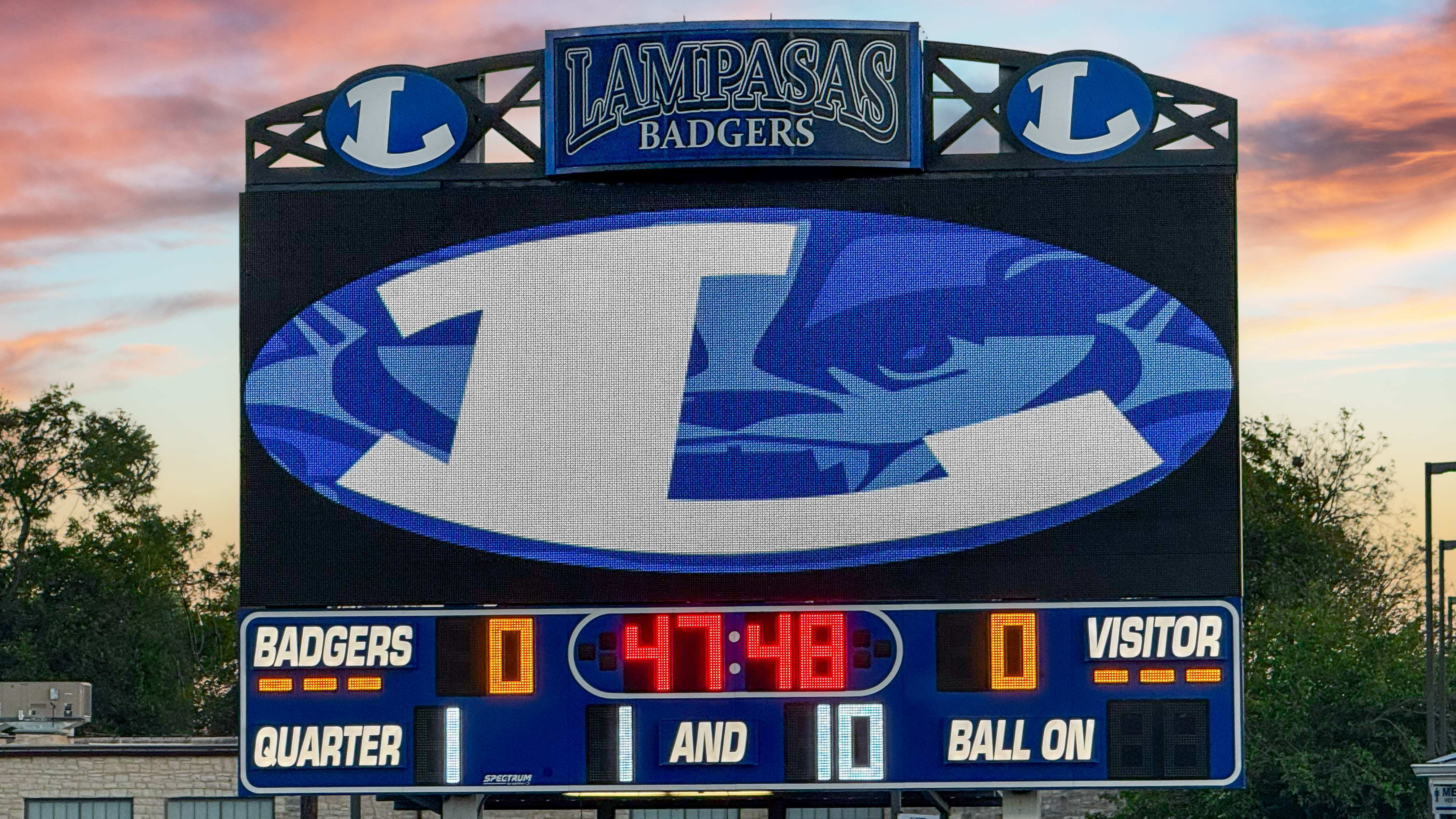 Two different digital scoreboards for high school football.