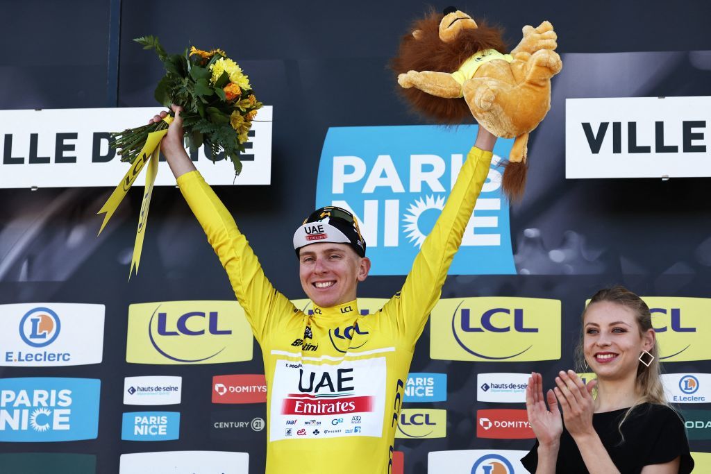 Overall winner UAE Team Emirates Slovenian rider Tadej Pogacar C wearing the overall leaders yellow jersey celebrates on the podium after winning the 8th and final stage of the 81st Paris Nice cycling race 1175 km between Nice and Nice in French riviera city of Nice southeastern France on March 12 2023 Slovenias Tadej Pogacar wins ParisNice title after winning the final stage on March 12 2023 Photo by AnneChristine POUJOULAT AFP Photo by ANNECHRISTINE POUJOULATAFP via Getty Images