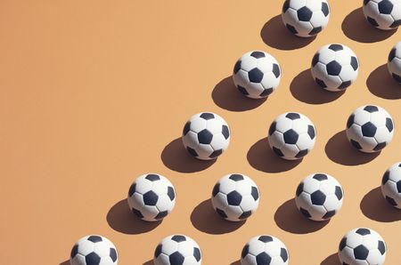 footballs on an orange background