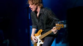 Bassist Jeff Pilson of American rock group Foreigner performing