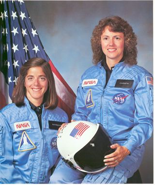 Christa McAuliffe and Barbara Morgan, Teacher in Space primary and backup crew members, appear in an official portrait for NASA's Space Shuttle Mission STS-51L. This mission ended in failure when the Challenger orbiter exploded 73 seconds after launch on