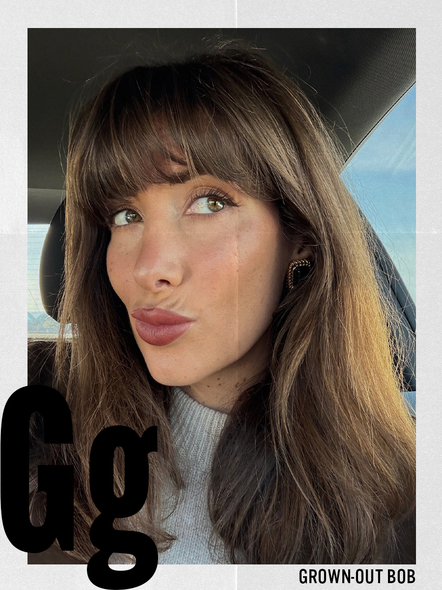 A woman taking a selfie with a grown-out bob