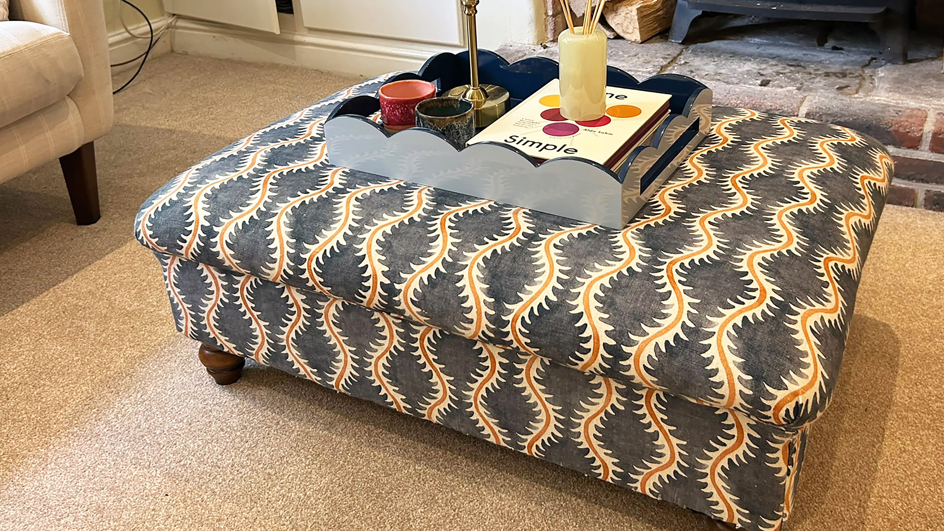 Upholstered footstool in living room