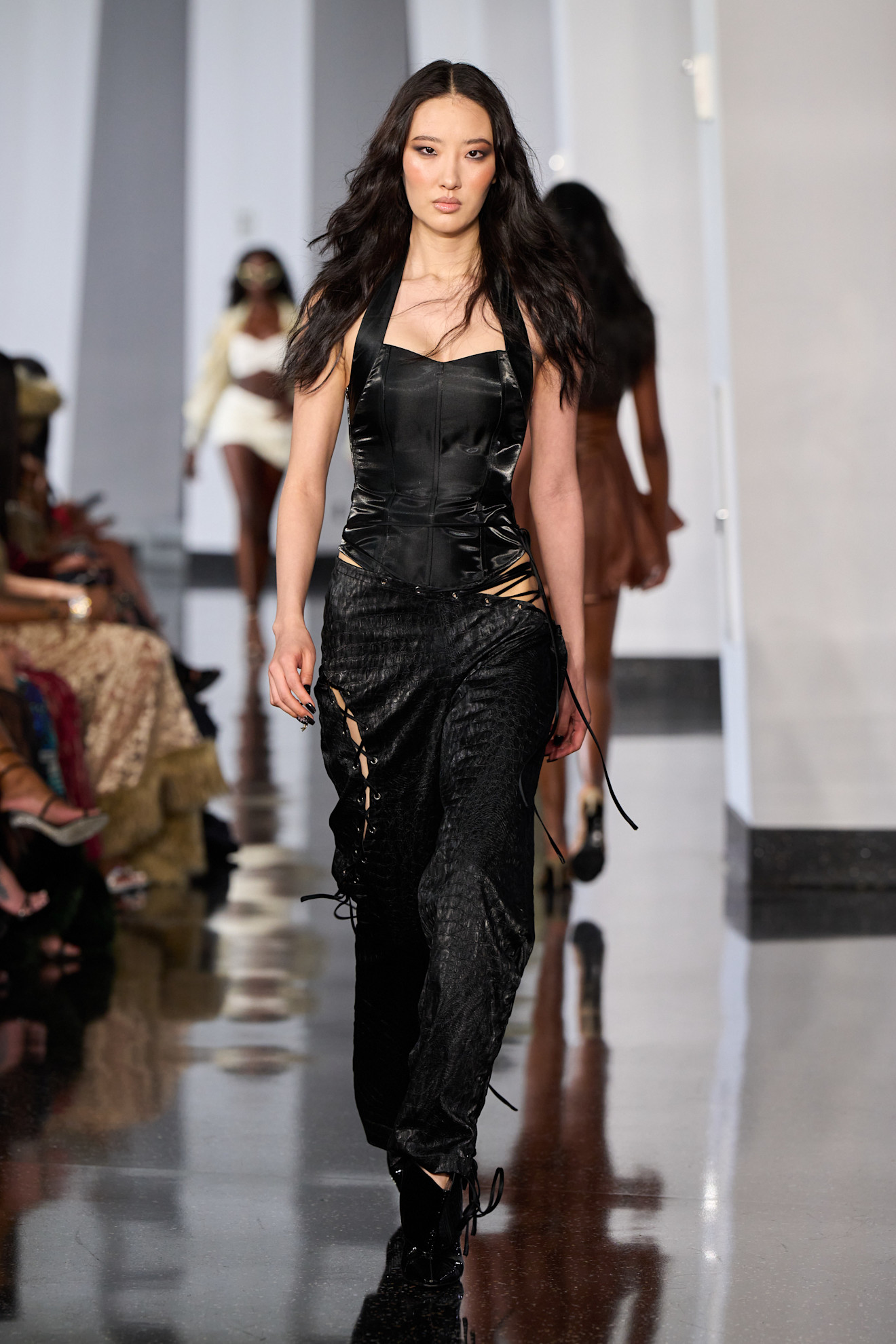 A model wore lace-up pants on Kim Shui's spring 2026 runway