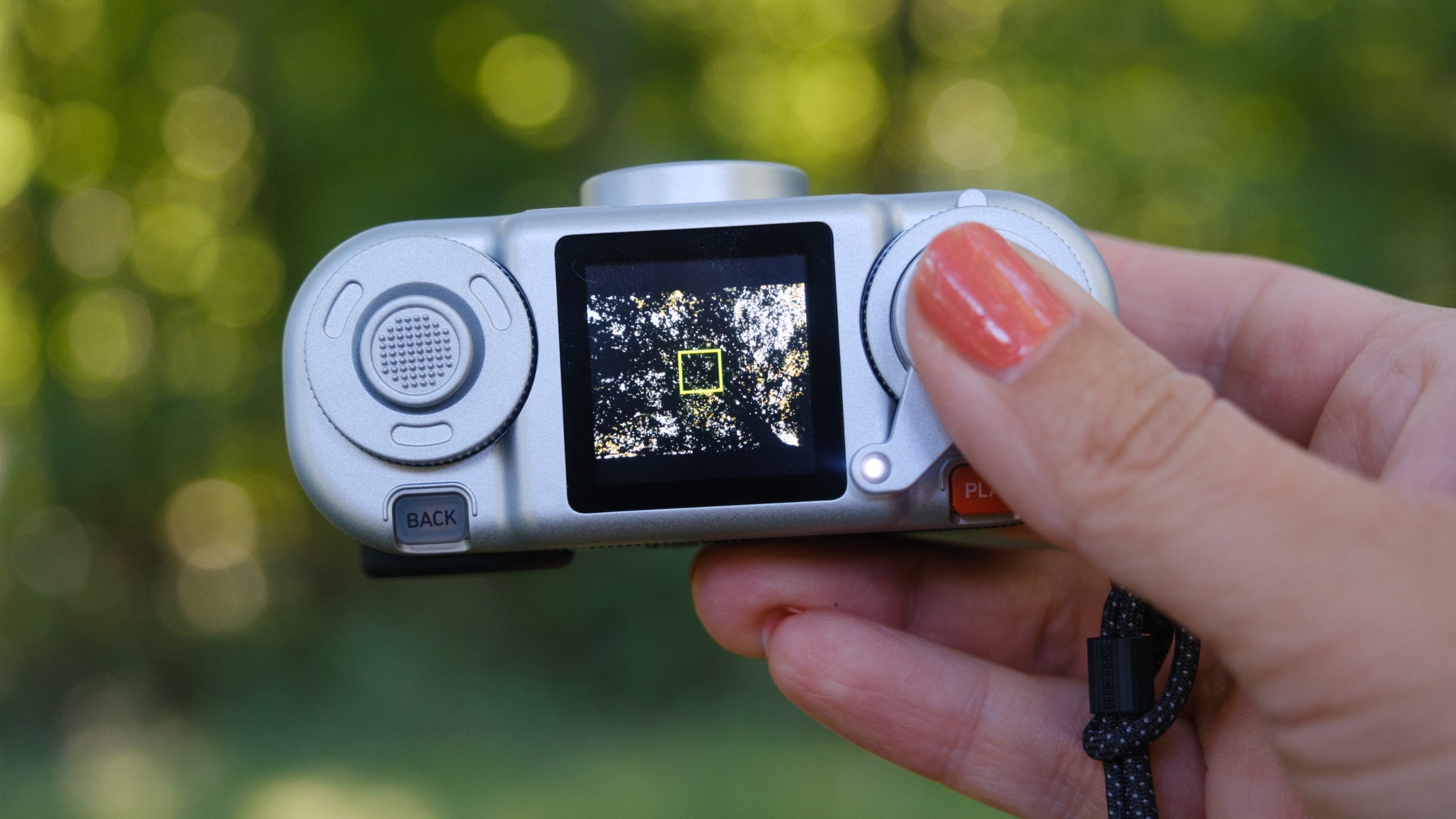The Instax Pal 2 held in a photographer's hands