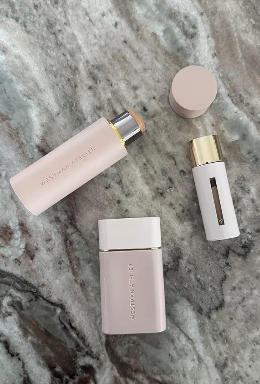 A photo of the Westman Atelier foundation stick, alongside the skin tint and concealer