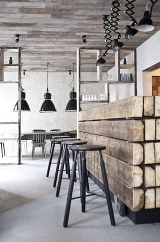 Raw interiors of an urban eatery with vintage lamps