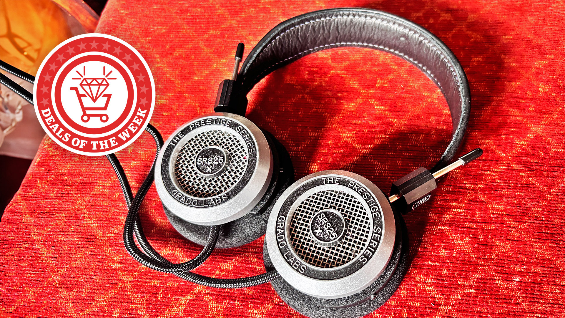 A picture of the Grado SR325x headphones on a red background, with the deals of the week logo overlaid