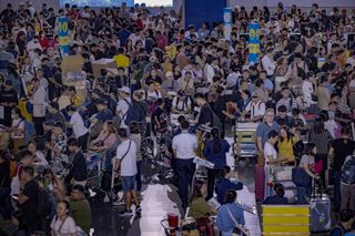 Lines of passengers form at the check-in counters at Ninoy Aquino International Airport amid a global IT disruption caused by a Microsoft outage and a Crowdstrike IT problem on July 19, 2024, in Manila, Philippines. A significant global outage affecting Microsoft services, particularly Microsoft 365, caused widespread disruptions across various sectors, including airlines, banks, and health systems. The outage was attributed to a glitch in CrowdStrike&#039;s &quot;Falcon Sensor&quot; software, which affected Windows systems, leading to thousands of flight cancellations and operational chaos in multiple industries.