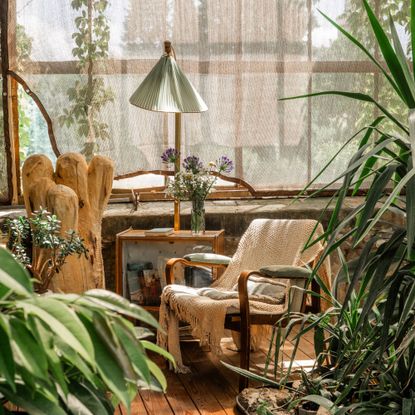 A charming reading nook in a greenhouse