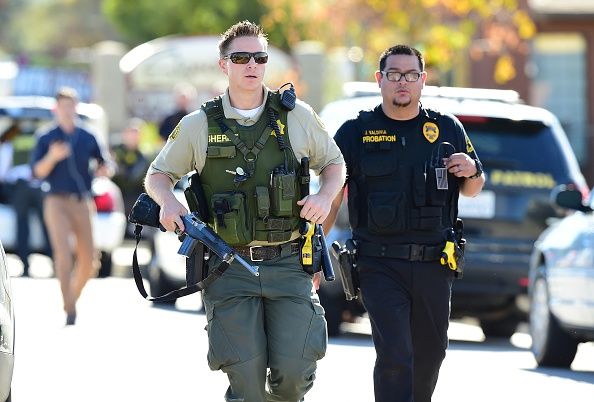 Police officers outside the Inland Regional Center.