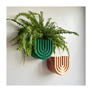 A set of colorful wall-mounted pots