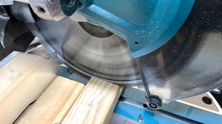 Close up of Makita brushless slide compound mitre saw blade in motion