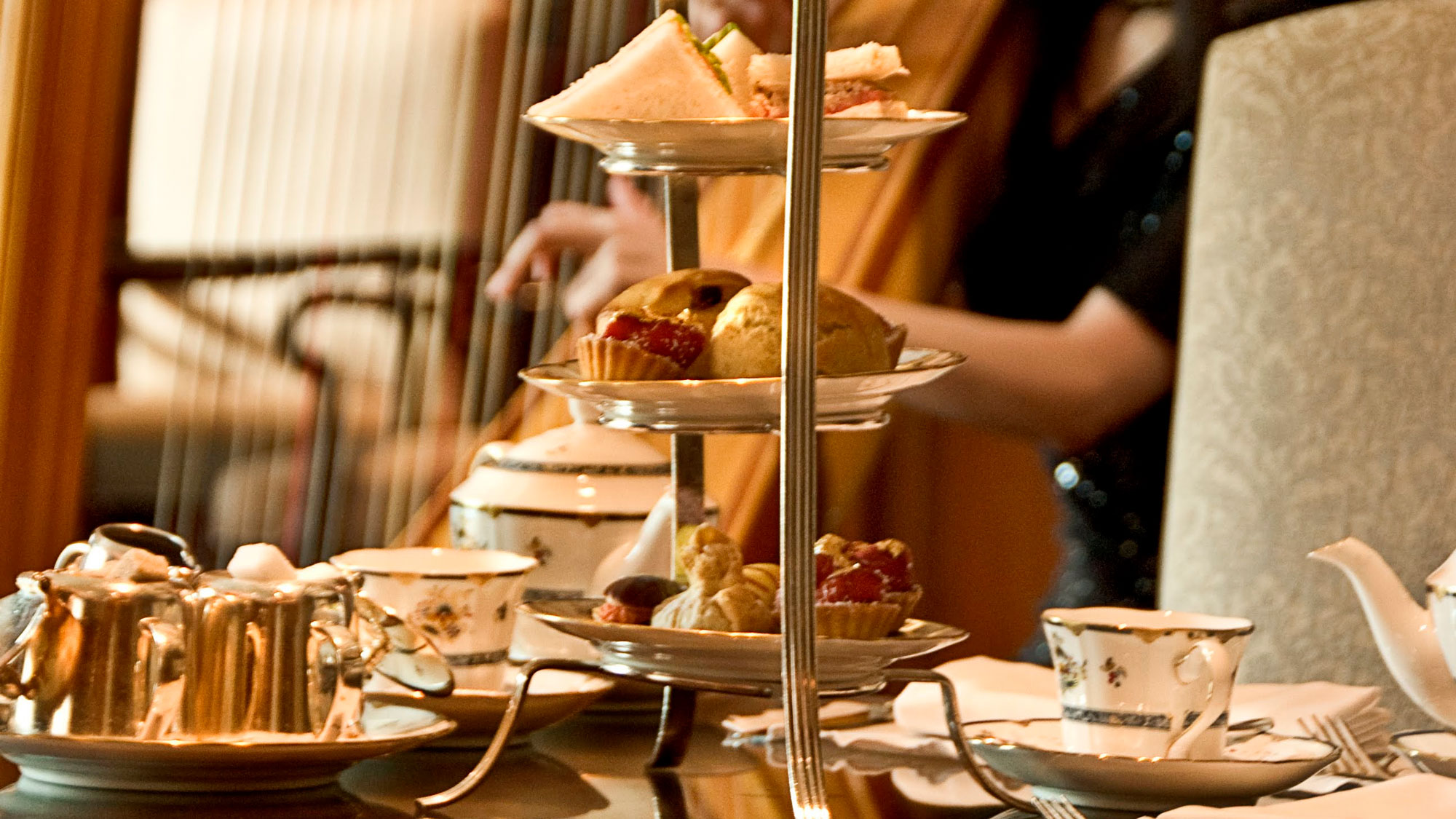 Afternoon tea with sandwiches and cakes