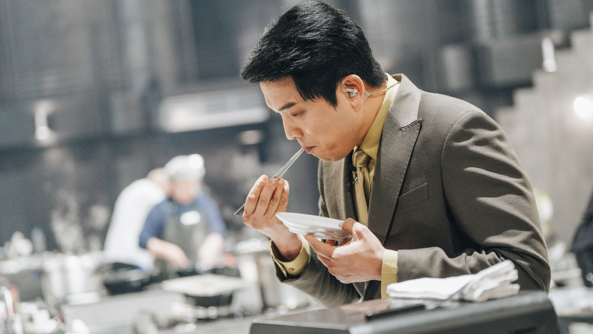 'Culinary Class Wars' judge Ahn Sung-jae tastes a dish, in a still from season 2.