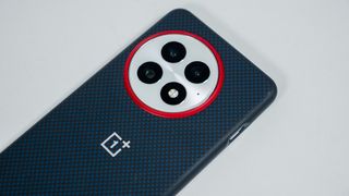 the official blue OnePlus 13 soft case and its red camera island highlight