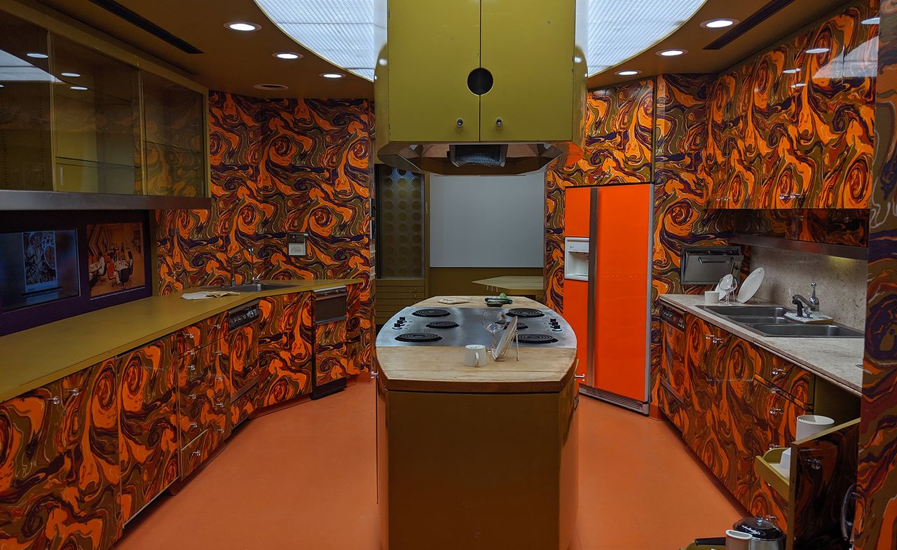 Orange and black marbled effect kitchen with a centre island, Installation view, ‘African/American: Making the Nation&#039;s Table&#039;, a New York exhibition