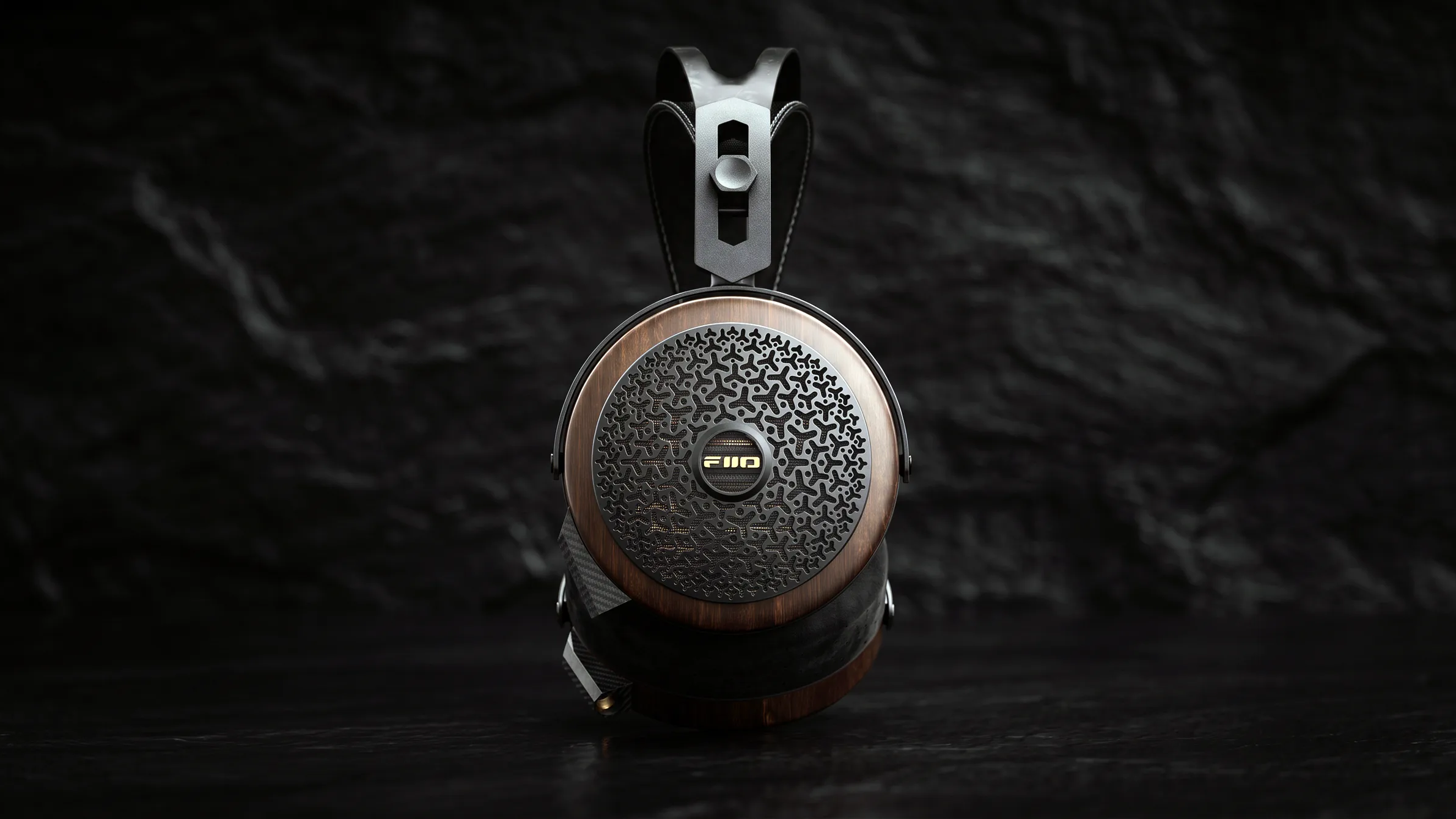 FiiO FT15 wired planar magnetic headphones in black walnut on a black background