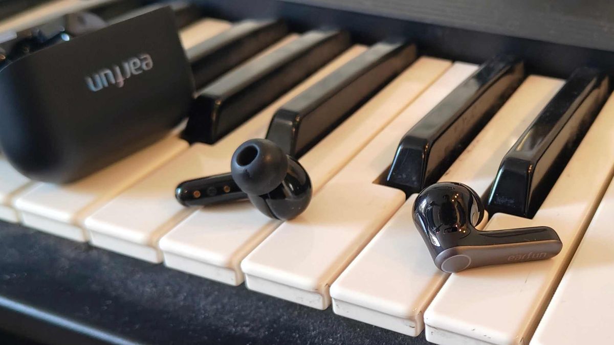 The Earfun Air Pro 4 Plus on top of a keyboard.