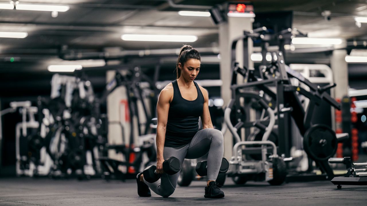 Woman performing dumbbell lunges