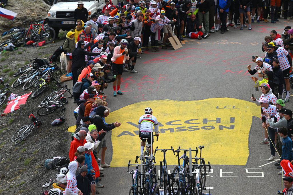 VALLOIRE FRANCE JULY 02 Mathieu van der Poel of Netherlands and Team Alpecin Deceuninck competes climbing to the Col du Galibier 2642m while fans cheer during the 111th Tour de France 2024 Stage 4 a 1394km stage from Pinerolo to Valloire UCIWT on July 02 2024 in Valloire France Photo by Dario BelingheriGetty Images