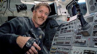 A NASA photo shows James Reilly, now the Trump-appointed director of the U.S. Geological Survey, aboard the space shuttle Atlantis in 2001. Reilly promised not to let political influences jeapordize science during his confirmation hearing in 2018.