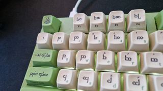 Drop + LOTR Elvish Keyboard review showing the elvish keycaps and subtle white backlight