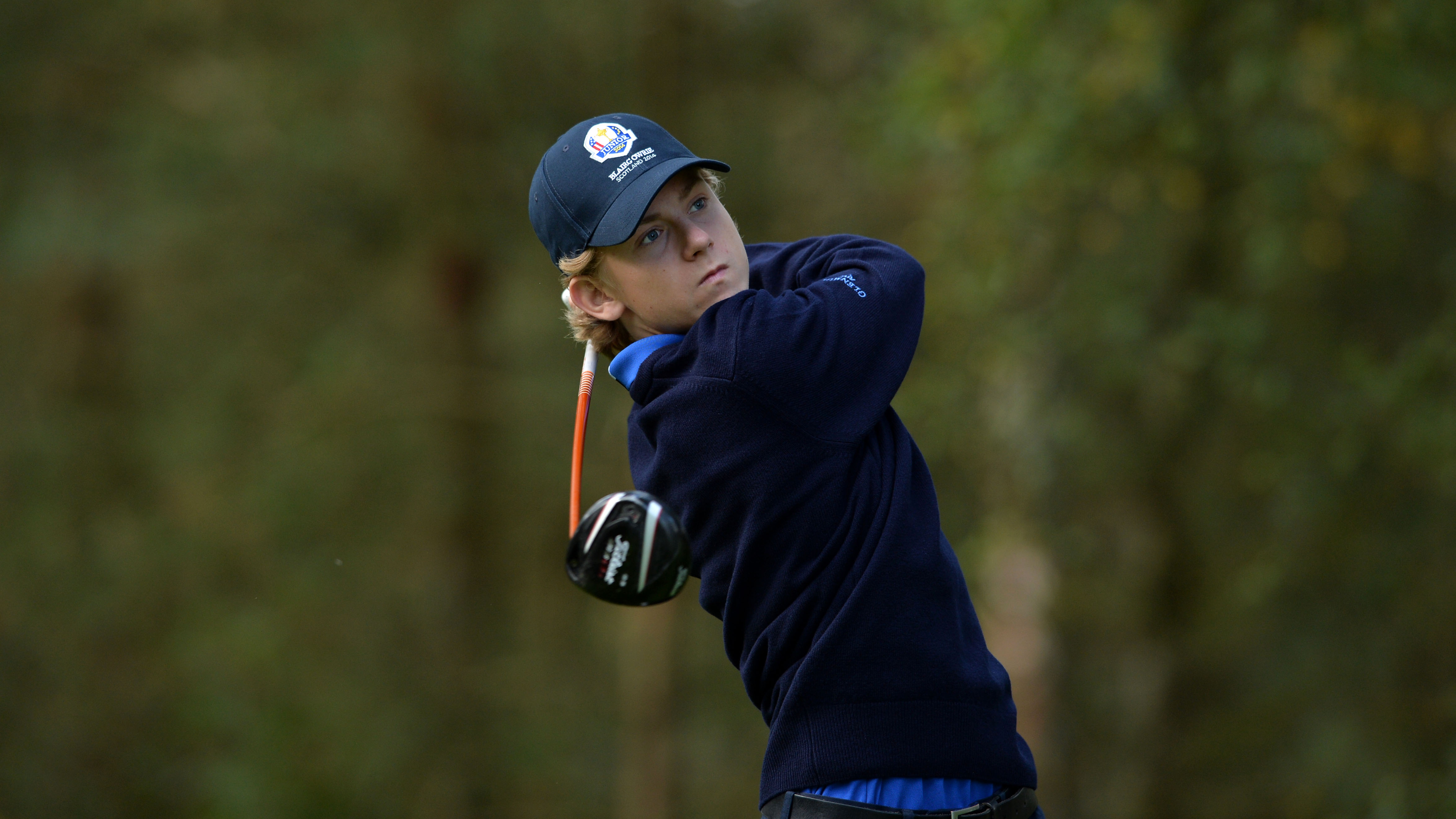 John Axelsen holding the pose after a drive at the 2014 Junior Ryder Cup