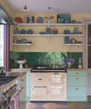 green tiled kitchen with yellow walls