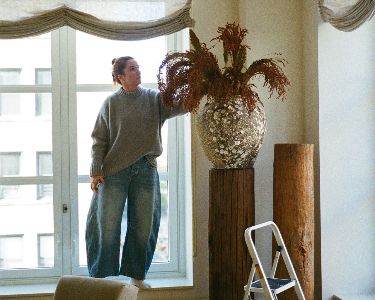 Katie Harbison arranging flowers on location