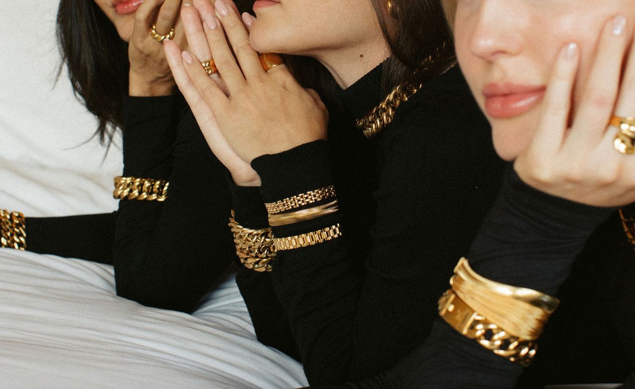  Models wear chunky gold jewellery by Anisa Sojka