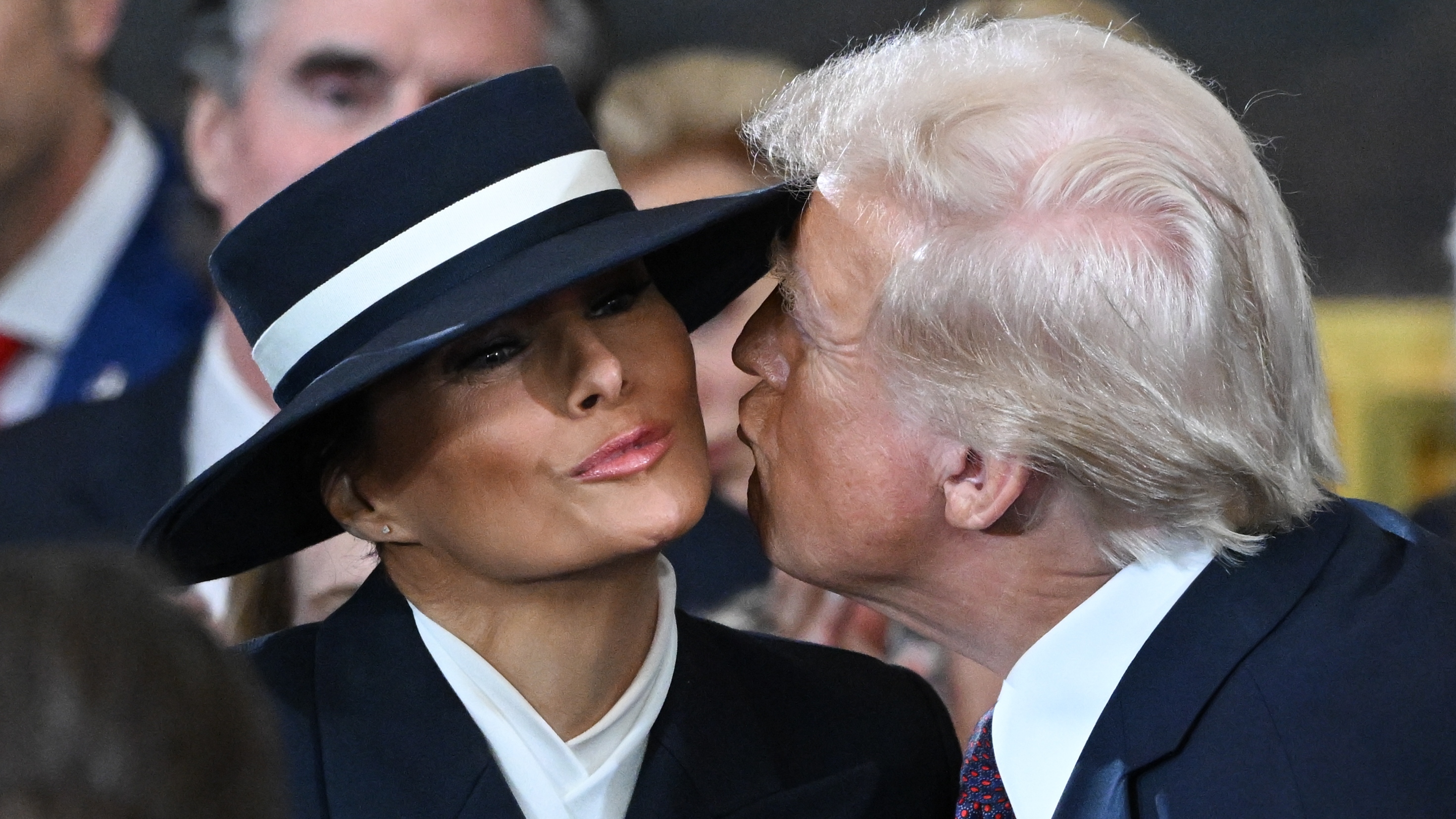 U.S. President-elect Donald Trump kisses Melania Trump at his inauguration in the U.S. Capitol Rotunda on January 20, 2025