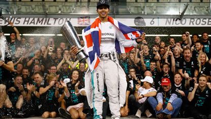 Lewis Hamilton celebrates after winning the Abu Dhabi Formula One Grand Prix at Yas Marina Circut