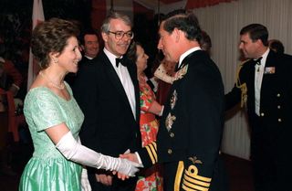 Prince Charles greeting Prime Minister John Major and his wife Norma in May 1995