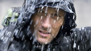 how to stay dry while hiking: man in wet conditions