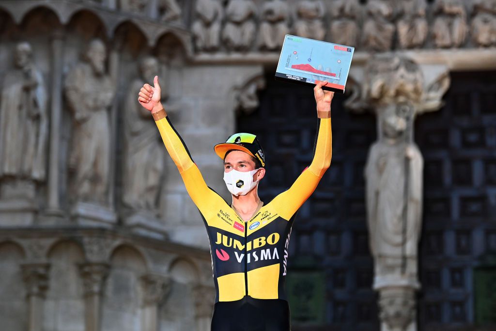 BURGOS SPAIN AUGUST 14 Primoz Roglic of Slovenia and Team Jumbo Visma celebrates winning on the podium ceremony after the 76th Tour of Spain 2021 Stage 1 a 71km individual time trial from Burgos Catedral de Santa Mara to Burgos lavuelta LaVuelta21 CapitalMundialdelCiclismo catedral2021 on August 14 2021 in Burgos Spain Photo by Stuart FranklinGetty Images