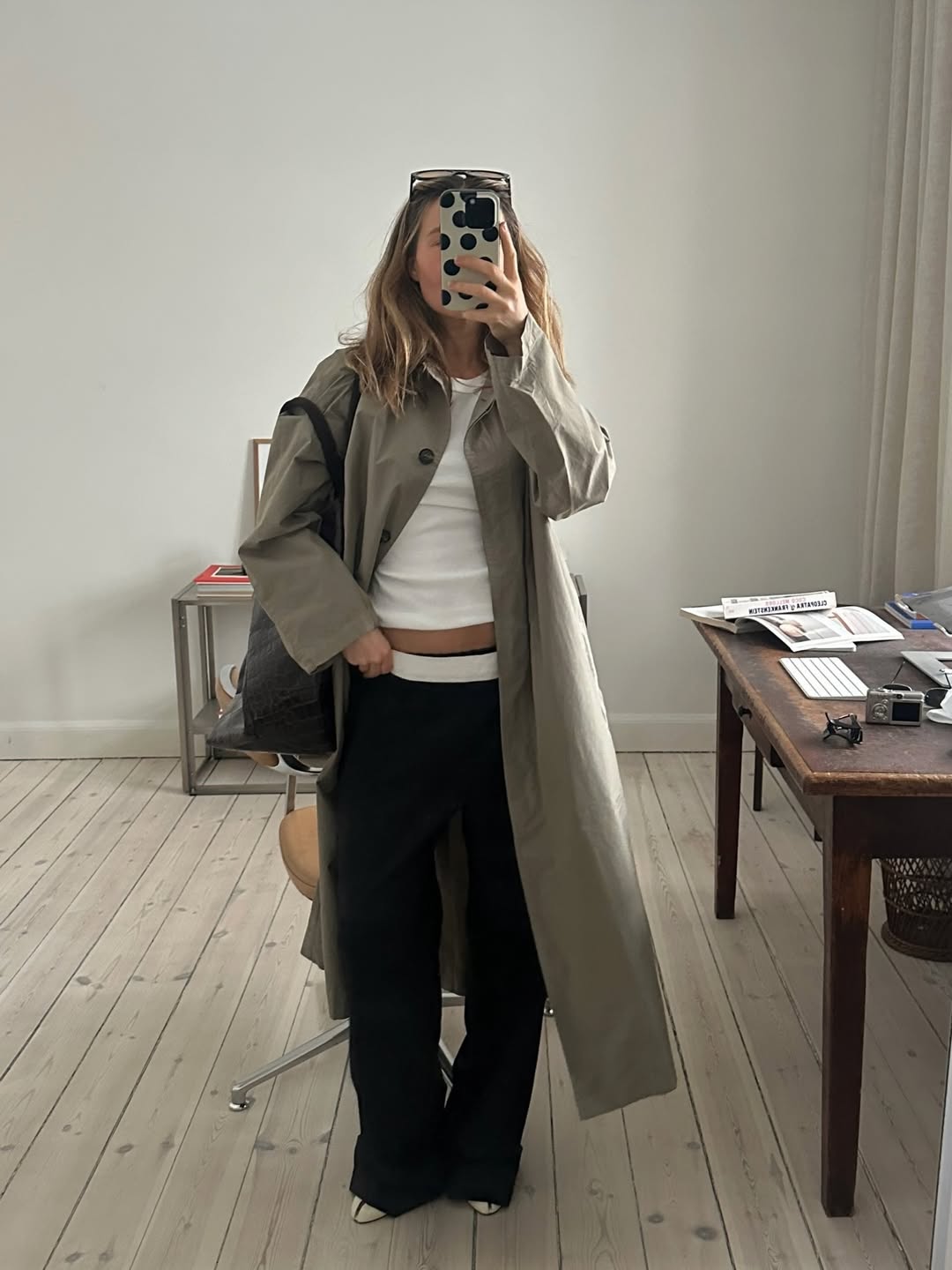 Influencer Camilla Birkbaek wearing low-rise trousers and a crew-neck t-shirt