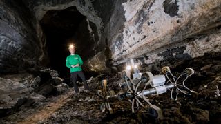 A prototype rover creeps through a lava tube in Spain’s Canary Island of Lanzarote, part of a training campaign to explore settings on Earth that could be similar to those on the moon and Mars.