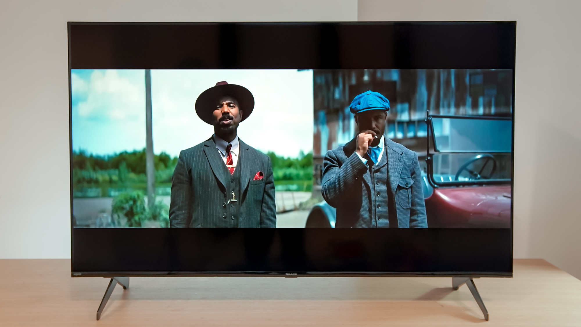 A Sharp Aquos QLED TV on a table